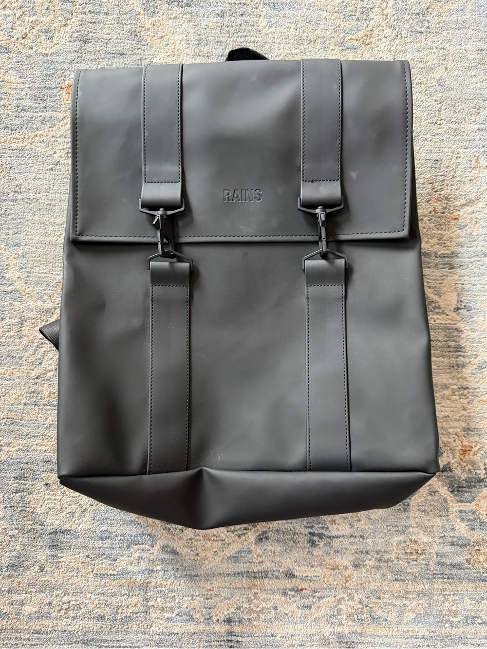 Rains Black Matte Rolltop Backpack with Buckle Straps